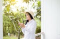 Portrait of beautiful asian women using smart phone and smiling at outdoor,Positive thinking,Happy and smiling Royalty Free Stock Photo