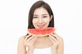 Portrait of a beautiful Asian young woman eating watermelon on w Royalty Free Stock Photo