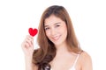 Portrait of beautiful asian young woman holding red heart shape pillow and smile isolated on white background Royalty Free Stock Photo