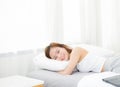 Portrait of beautiful asian young woman sleep lying in bed with head on pillow comfortable and happy with leisure Royalty Free Stock Photo