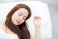 Portrait of beautiful asian young woman sleep lying in bed with head on pillow comfortable and happy with leisure. Royalty Free Stock Photo