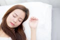 Portrait of beautiful asian young woman sleep lying in bed with head on pillow comfortable and happy with leisure. Royalty Free Stock Photo