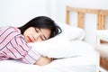 Portrait of beautiful asian young woman sleep lying in bed with Royalty Free Stock Photo