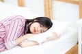 Portrait of beautiful asian young woman sleep lying in bed with head on pillow comfortable and happy Royalty Free Stock Photo