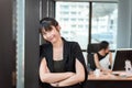 Portrait of Beautiful Attractive Business Woman Standing Beside Windows Frame in Modern Office, Confident Asian Girl in Arms Royalty Free Stock Photo