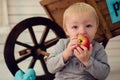 Portrait of beautiful baby boy eating apple Royalty Free Stock Photo