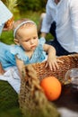 Portrait of beautiful baby girl play with basket of fruits Royalty Free Stock Photo