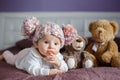 Portrait of a beautiful baby with plush toys Royalty Free Stock Photo