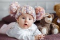 Portrait of a beautiful baby with plush toys Royalty Free Stock Photo