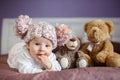 Portrait of a beautiful baby with plush toys Royalty Free Stock Photo