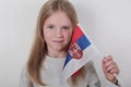 Portrait beautiful blond girl with the flag of Serbia. Football or soccer team fan, sport event and patriotism concept. Royalty Free Stock Photo