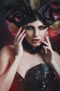 Portrait of beautiful blond woman in dark corset Royalty Free Stock Photo
