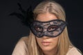 Portrait of a beautiful blond woman wearing black mask. Fashion Royalty Free Stock Photo