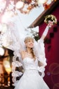 Portrait of a beautiful blonde bride with wedding bouqet