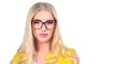 Portrait of beautiful blonde casual girl with glasses