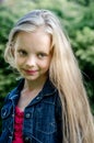 Portrait of a beautiful blonde little girl with long hair. Royalty Free Stock Photo