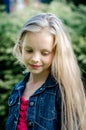 Portrait of a beautiful blonde little girl with long hair. Royalty Free Stock Photo