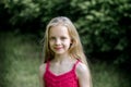 Portrait of a beautiful blonde little girl with long hair. Royalty Free Stock Photo