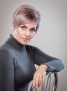 Portrait of a beautiful blonde woman with beautiful make-up and short haircut after dyeing hair