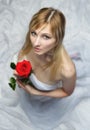 Beautiful blonde woman with red rose Royalty Free Stock Photo