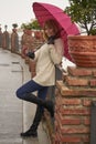 Portrait of beautiful blonde woman with red umbrella Royalty Free Stock Photo