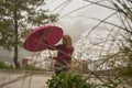 Portrait of beautiful blonde woman with red umbrella Royalty Free Stock Photo