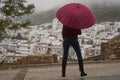 Portrait of beautiful blonde woman with red umbrella Royalty Free Stock Photo