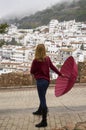 Portrait of beautiful blonde woman with red umbrella Royalty Free Stock Photo