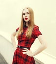 Portrait beautiful blonde woman wearing red checkered dress Royalty Free Stock Photo