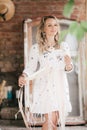 Portrait of beautiful blonde girl in boho style