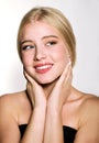 Portrait of beautiful blonde young woman face.  Spa model girl with fresh clean skin isolated on a white background Royalty Free Stock Photo