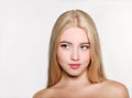 Portrait of beautiful blonde young woman face.  Spa model girl with fresh clean skin  on a white background Royalty Free Stock Photo