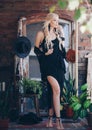 Portrait of beautiful bohemian girl in the black clothing of style of boho in a summer arbour Royalty Free Stock Photo