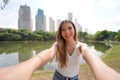 Portrait of beautiful Brazilian girl takes selfie in Areiao Park in Goiania, Goias, Brazil Royalty Free Stock Photo