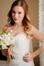 portrait of a beautiful bride with a bouquet. Wedding traditions.