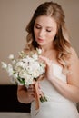 portrait of a beautiful bride with a bouquet. Wedding traditions.