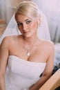 Portrait of beautiful bride with fashion veil posing at home at Royalty Free Stock Photo