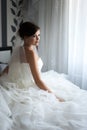 Portrait of beautiful bride with fashion veil posing at home at Royalty Free Stock Photo