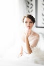 Portrait of beautiful bride with fashion veil posing at home at Royalty Free Stock Photo