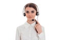 Portrait of beautiful brunette call center worker girl with headphones and microphone isolated on white background Royalty Free Stock Photo