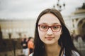 Portrait of a beautiful brunette girl with glasses. Toned photo, instaram style