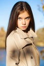 Portrait of a beautiful brunette little girl, autumn park outdoors Royalty Free Stock Photo