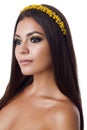 Portrait of beautiful brunette woman with big earring and shinny yellow accessories in hair. Perfect arabic makeup with