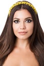 Portrait of beautiful brunette woman with big earring and shinny yellow accessories in hair. Perfect arabic makeup with