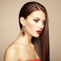 Portrait of beautiful brunette woman with earring. Perfect makeup