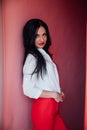 Portrait of a beautiful brunette woman with a haircut in red clothes Royalty Free Stock Photo