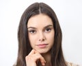 Portrait of beautiful brunette young woman with brown eyes isolated on white background close up Royalty Free Stock Photo