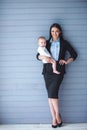 Business lady with her baby Royalty Free Stock Photo