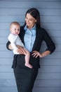 Business lady with her baby Royalty Free Stock Photo