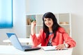 Portrait of beautiful business woman working at her desk with laptop. Royalty Free Stock Photo